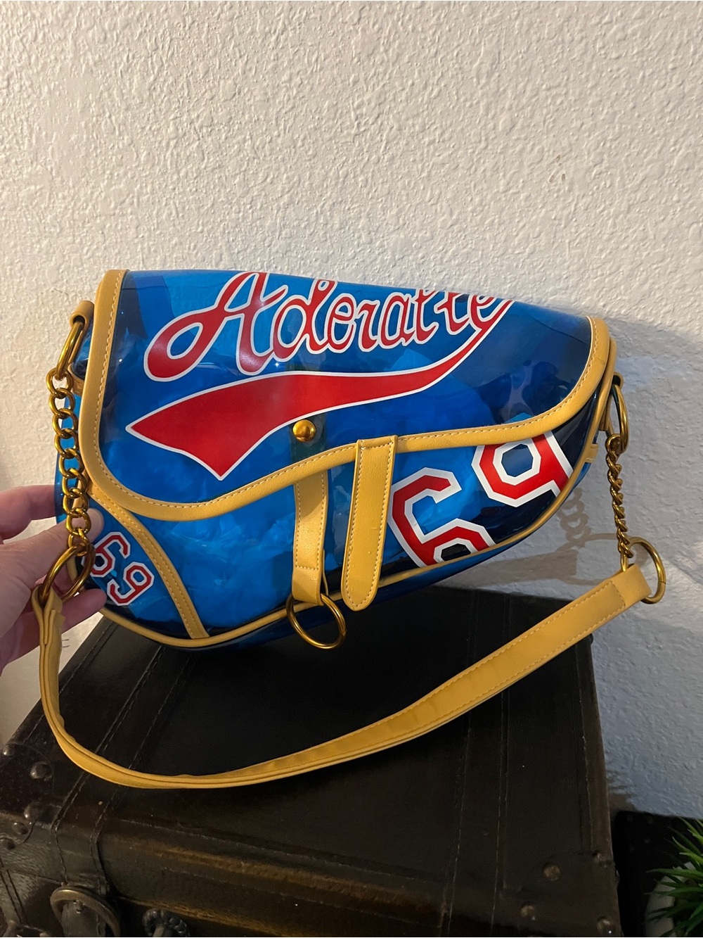 Blue and Yellow Graphic Shoulder Bag with Red Script